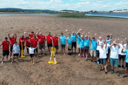 Britain's most unusual cricket match played on the River Exe estuary at low tide saw Exmouth RNLI beat Exmouth Freemasons by three runs. The unique event may become annual.