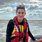 24-year-old Becky Cannon becomes RNLI's youngest female coxswain, continuing an 80-year family legacy. She credits her late grandfather, Ron Cannon MBE, for her inspiration.