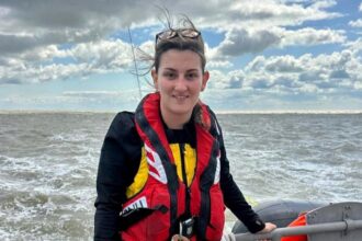 24-year-old Becky Cannon becomes RNLI's youngest female coxswain, continuing an 80-year family legacy. She credits her late grandfather, Ron Cannon MBE, for her inspiration.