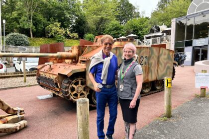 Cliff Richard, 83, enjoys a summer holiday in Jersey, visiting history museums and dining at local restaurants. Fans thrilled by his casual and charming presence.