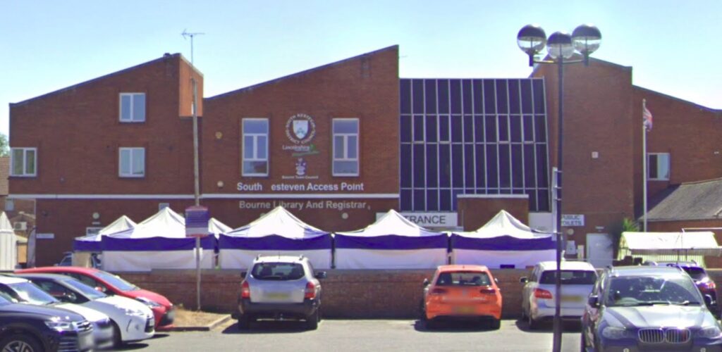 Council blunder leaves 'access point' sign reading 'a cess pint' after letters fall off building in South Kesteven, Lincolnshire. Locals react with humor and calls for repairs.