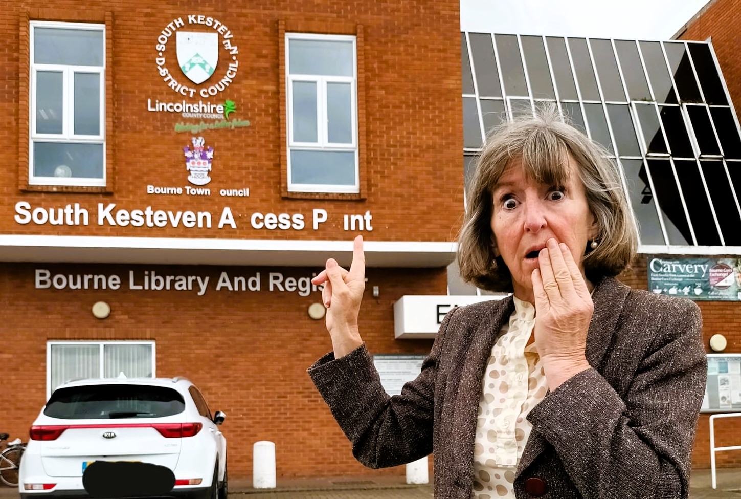 Council blunder leaves 'access point' sign reading 'a cess pint' after letters fall off building in South Kesteven, Lincolnshire. Locals react with humor and calls for repairs.