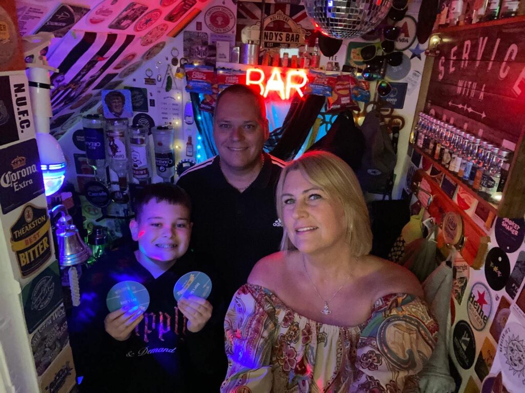 Andy Dyer, 51, transformed the cupboard under his stairs into Britain's smallest bar. With £800 spent, it's a quirky haven complete with a draft beer machine, neon sign, and disco ball.