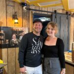 Dermot O'Leary surprised staff at Flapjackery in Wells, Somerset, with a visit after Glastonbury Festival, delighting customers as he fueled up on flapjacks from the speciality shop.