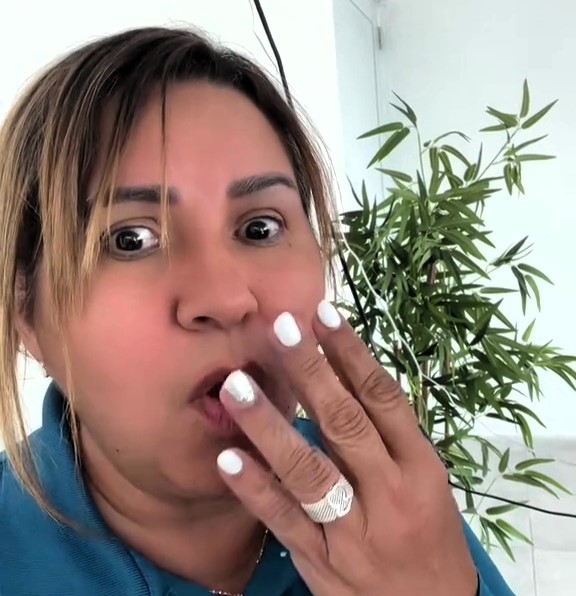 A woman waters a plastic plant for four years before realizing it's fake, sharing her funny story on TikTok. The viral video garners 7 million views and 15,000 comments.