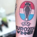 Dutch football fan Bart Blom tattoos "Uefa Euro 2024 winner" on his arm, confident of a Netherlands victory. He could win £8,400 if the Dutch team wins the championship.