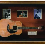 Elvis Presley's iconic Martin & Co. D-35 acoustic guitar, used in 1976 performances, is up for auction with bids expected between £11,600-£20,000. A collectible piece for music fans.