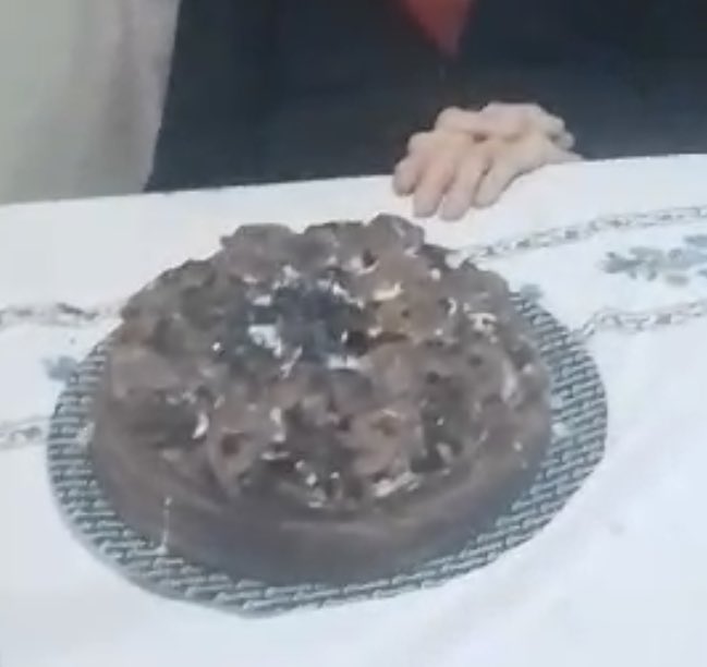 Elderly gran's 95th birthday almost ends in disaster as 95 candles set cake ablaze. Family quickly extinguishes flames, avoiding calamity. Cake remains edible despite wax.