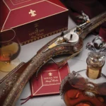 A 400-year-old gold and silver rifle, once owned by King Louis XIII and made by renowned gunmaker Francois Poumerol, is up for auction at £330,000 ($425,000).