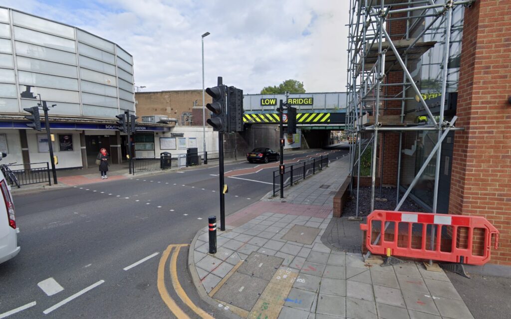 A trucker wedged his HGV under a 15ft 9in bridge near South Ruislip station, west London, despite clear height warnings. Traffic built up as locals filmed the aftermath.