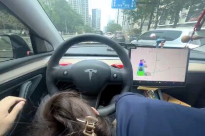 A man filmed himself in a Tesla as a woman appeared to perform a sex act while driving on a busy road in China, sparking outrage. The incident has raised safety concerns.