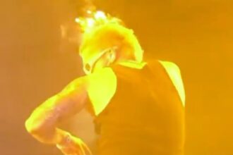 Reggaeton star Reykon's hair catches fire during concert mishap. He suffers burns but finishes his set. No serious injuries reported. Watch the dramatic footage!