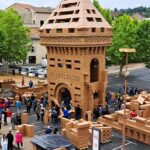 Locals in Graulhet, France, built a 1.5-ton cardboard castle, only to demolish it the next day. The project celebrated a legendary 10th-century castle, uniting the community.