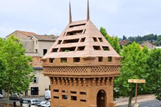 Locals in Graulhet, France, built a 1.5-ton cardboard castle, only to demolish it the next day. The project celebrated a legendary 10th-century castle, uniting the community.