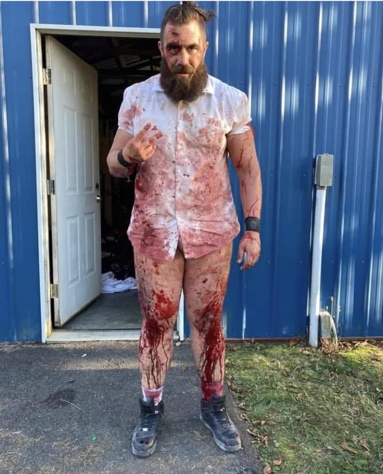 Joe Mcgivern, a store security worker by day, earns £12,000 annually from weekend death wrestling. This hardcore hobby, involving glass and blood, offers a surreal thrill and helps pay the bills.