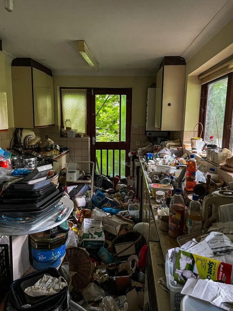 Urban explorer Sean Piper's TikTok video reveals a severely overgrown, abandoned hoarder's home in Kent, filled with damp clothes, animal droppings, and personal belongings.