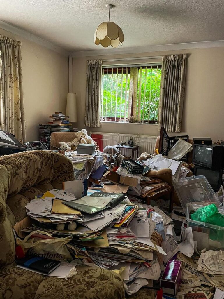 Urban explorer Sean Piper's TikTok video reveals a severely overgrown, abandoned hoarder's home in Kent, filled with damp clothes, animal droppings, and personal belongings.