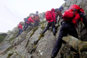 A walker on the 15 Peaks Challenge in Snowdonia was rescued with hypothermia in July. Ogwen Valley Mountain Rescue provided aid and urged hikers to check weather conditions.