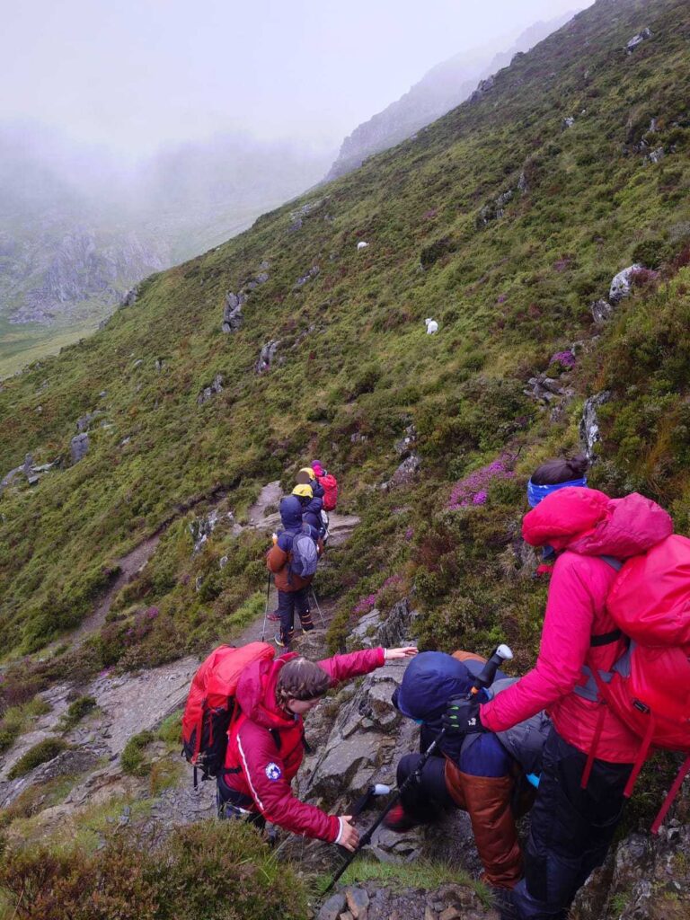 A walker on the 15 Peaks Challenge in Snowdonia was rescued with hypothermia in July. Ogwen Valley Mountain Rescue provided aid and urged hikers to check weather conditions.