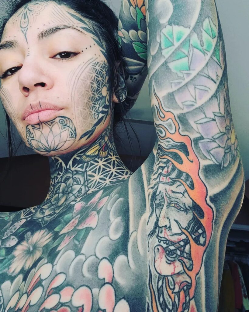 A woman with 98% of her body tattooed faces online trolls but values her ink for its spiritual significance. Sober and in recovery, she finds the tattoo process meditative and healing.