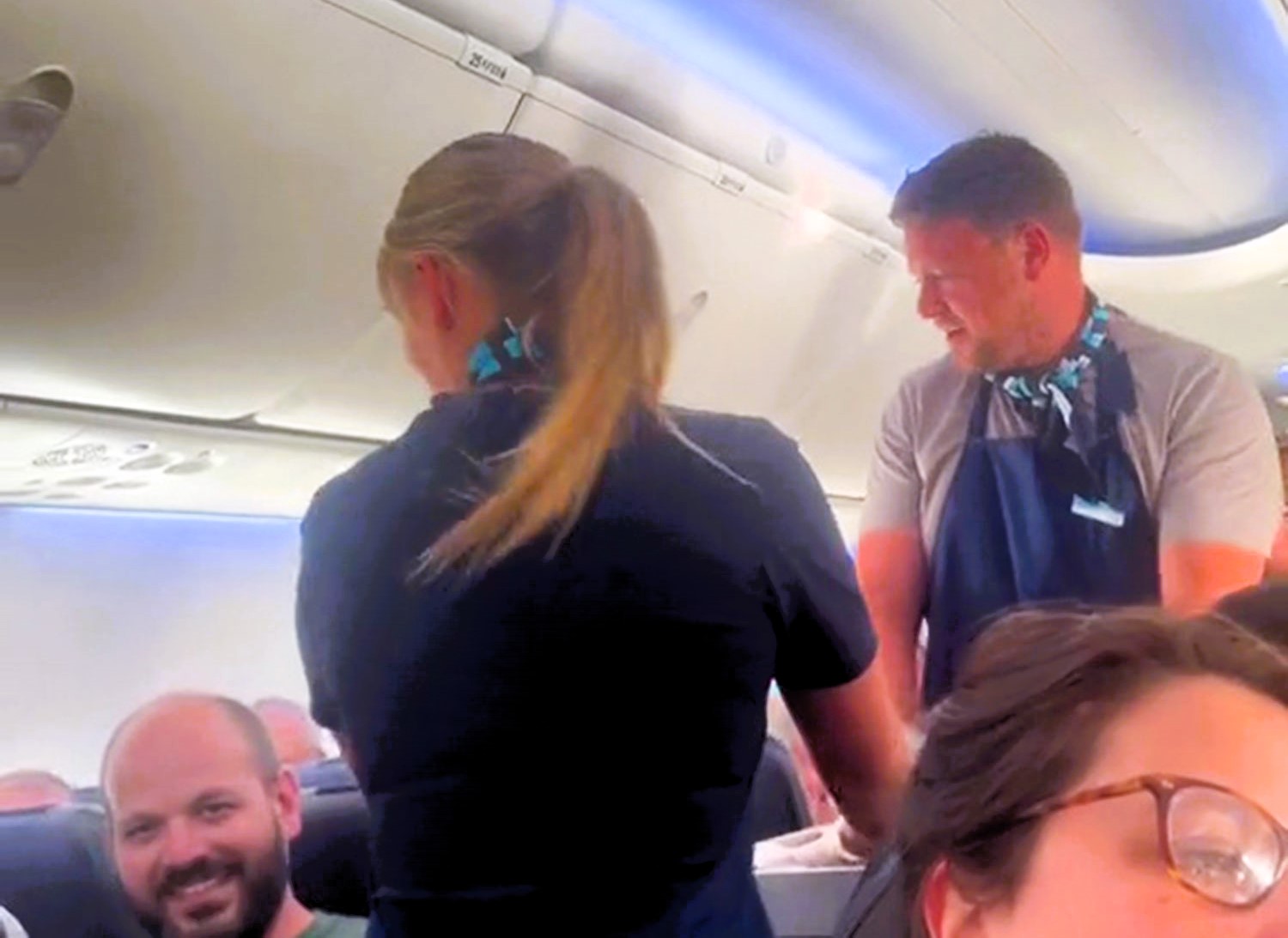 Plane passenger hilariously helps cabin crew collect rubbish mid-flight after going to the loo, Olivia Power shares the viral moment on TikTok, garnering over 24 million views.