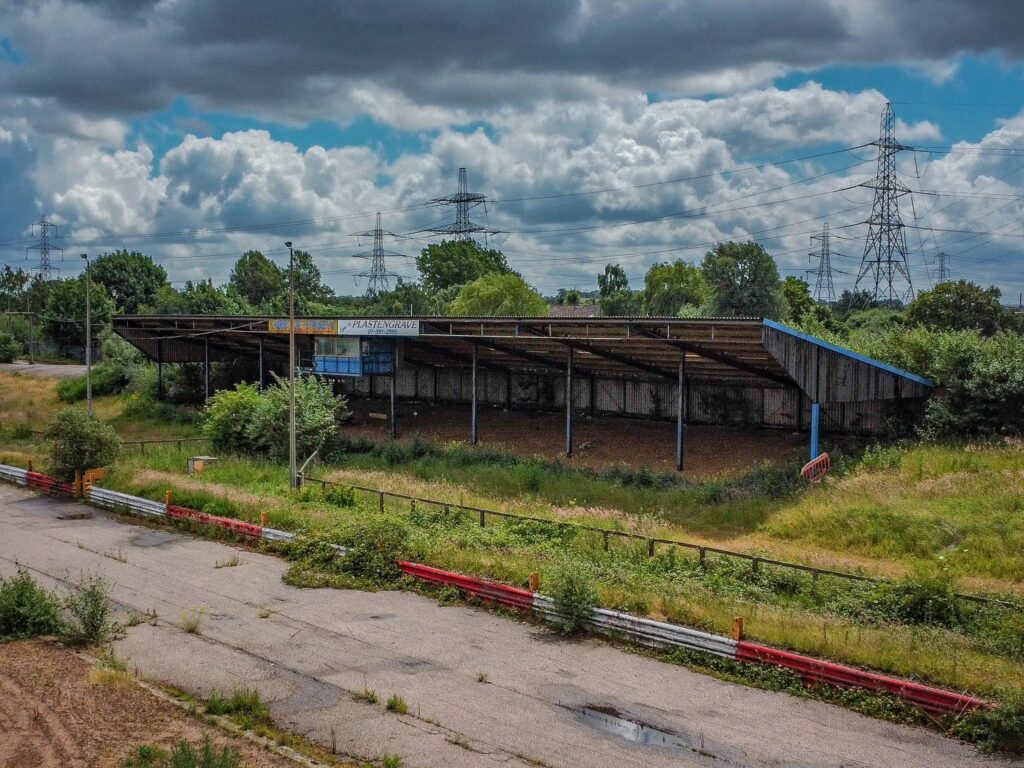 An explorer discovered the abandoned Arena Essex racetrack, now reclaimed by nature. Once a bustling site, it closed in 2018. Fans recall fond memories of the track.