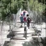 Pupils in Buraga, Colombia, cross a rickety suspension bridge over a crocodile-infested river daily to reach school, while others in Molagavita use a dangerous zipline across the Chicamocha River.