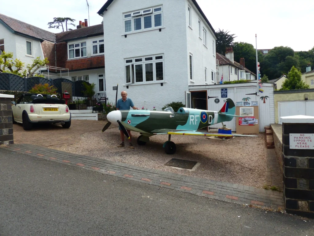 Retired handyman Rikki Scott, 76, builds stunning three-quarter scale Spitfire replica in his Torquay garage over three years, amazing neighbors with his craftsmanship and dedication.