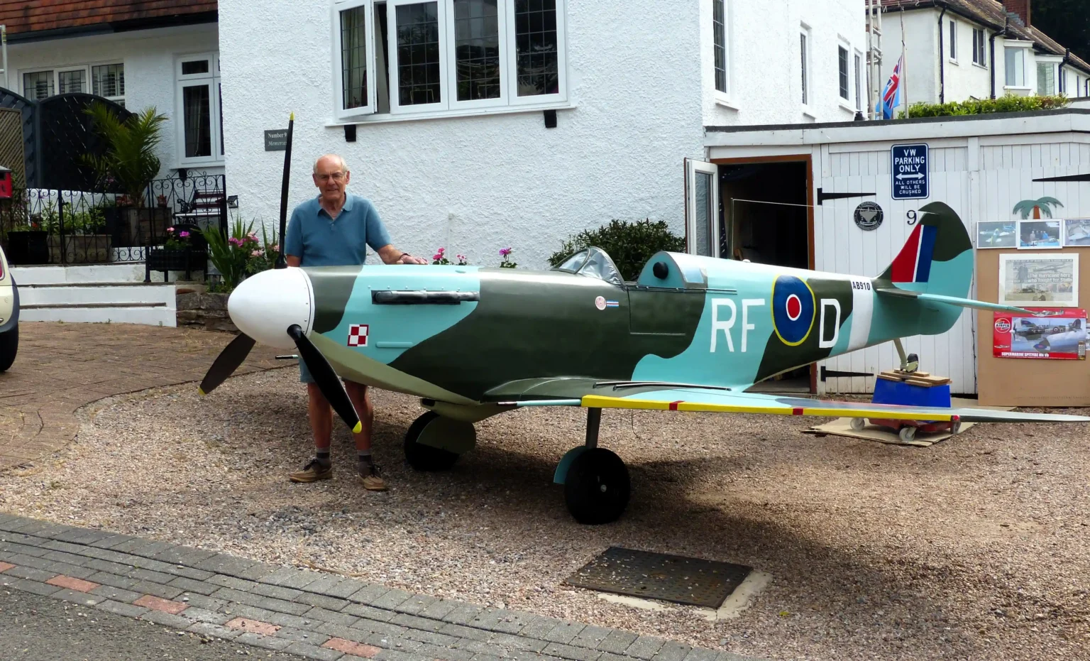 Retired handyman Rikki Scott, 76, builds stunning three-quarter scale Spitfire replica in his Torquay garage over three years, amazing neighbors with his craftsmanship and dedication.