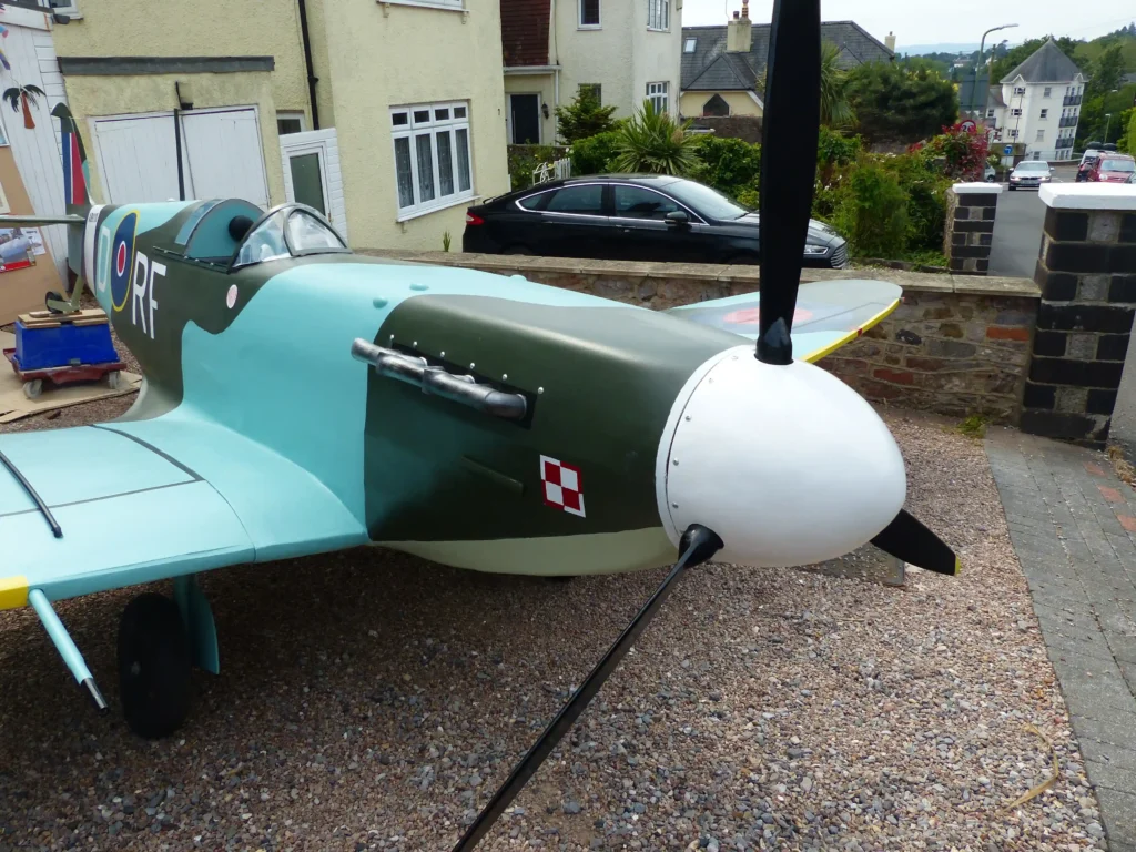 Retired handyman Rikki Scott, 76, builds stunning three-quarter scale Spitfire replica in his Torquay garage over three years, amazing neighbors with his craftsmanship and dedication.