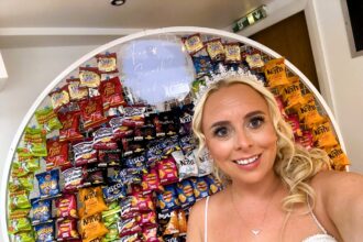 Bride and groom transform wedding with a giant wall of 200 crisps packs. Guests loved the unique theme, making their day a viral hit with over 700,000 TikTok views.