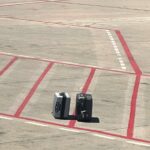 A passenger at Madrid's Barajas airport spotted his family's suitcases left on the tarmac before takeoff. Despite the mishap, their luggage, including cheese, arrived safely later.