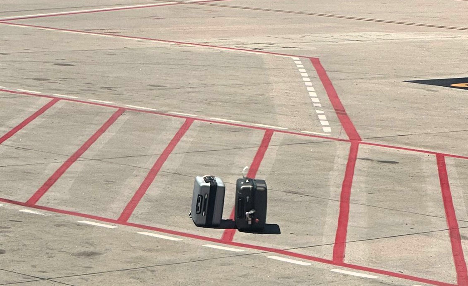 A passenger at Madrid's Barajas airport spotted his family's suitcases left on the tarmac before takeoff. Despite the mishap, their luggage, including cheese, arrived safely later.