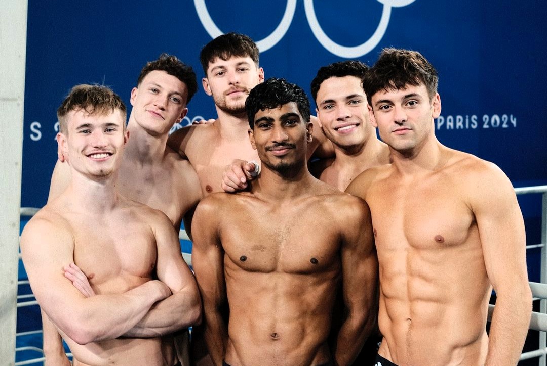 Olympic gold medalist Tom Daley's cheeky "Six boys, five rings" caption sparks laughs and lewd interpretations online ahead of Paris Games. Fans and celebs react humorously.