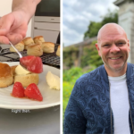 Chef Tom Kerridge sparks debate over scone pronunciation, upsetting fans. Northerners prefer 'scon' while Southerners, like Kerridge, say 'scone'. Recipe coincides with Wimbledon.