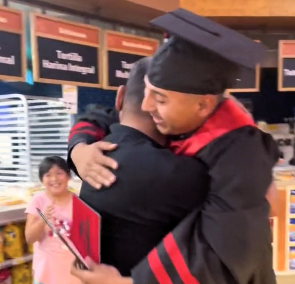 A high school graduate surprises his dad at his supermarket job to celebrate his achievement, resulting in a heartfelt viral moment with nearly 8 million views on TikTok.