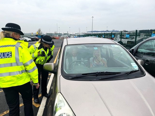 Police at Birmingham Airport spot headrest covers mistaken for bank robbers. The prank follows a similar incident from March, sparking humorous reactions online.