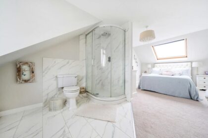 A £550,000 Saffron Walden home with a controversial open-plan en-suite raises hygiene concerns but offers four bedrooms, a large garden, and spacious living areas.