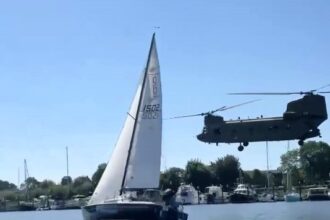 A casual speedboat ride turns thrilling as a man races a low-flying Chinook helicopter, capturing the GTA-like moment with over 220,000 views on social media.