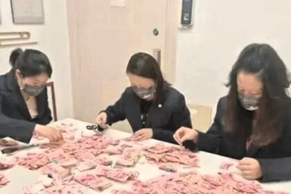 Bank workers in China painstakingly piece together £3,450 in damaged notes after a woman cut up her savings. Their 22-day effort aids a struggling family in need.