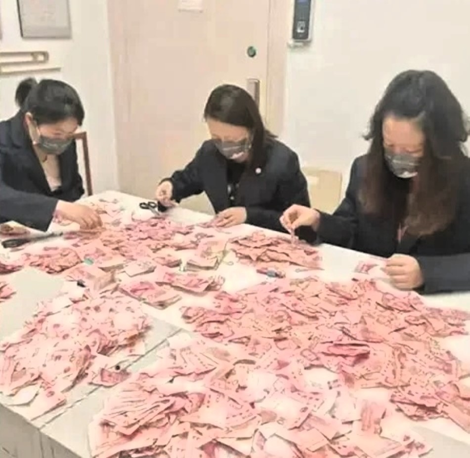 Bank workers in China painstakingly piece together £3,450 in damaged notes after a woman cut up her savings. Their 22-day effort aids a struggling family in need.