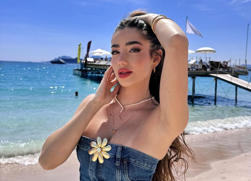 An influencer accidentally headbutted a shark while diving in the Maldives. She shared the viral clip with her 12.7M TikTok followers, expressing heartfelt apologies.