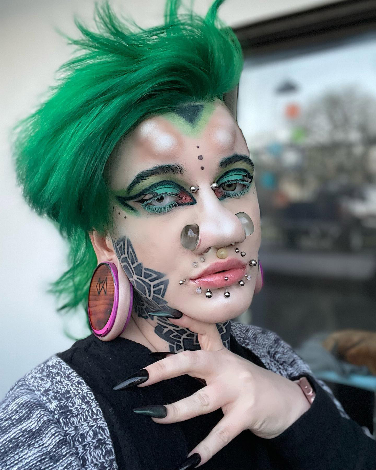 Body modification enthusiast aims for world's largest nostrils, currently at 27mm. Despite judgment, she embraces her passion and plans to enter Guinness World Records.