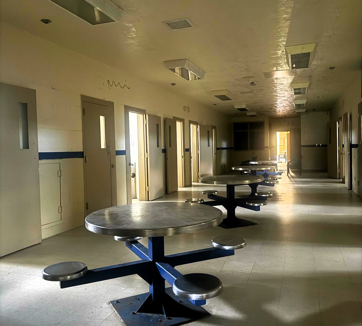 Urban explorer ventures into an abandoned Florida prison, capturing chilling scenes reminiscent of 'The Walking Dead,' including eerie cell blocks and a deserted medical wing.