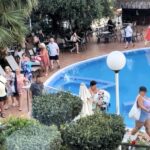 British holidaymakers race to secure sun loungers at H10 Delfin in Salou, Spain, despite the hotel's no-reserve rule, turning the early morning dash into a daily spectacle.