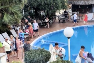 British holidaymakers race to secure sun loungers at H10 Delfin in Salou, Spain, despite the hotel's no-reserve rule, turning the early morning dash into a daily spectacle.