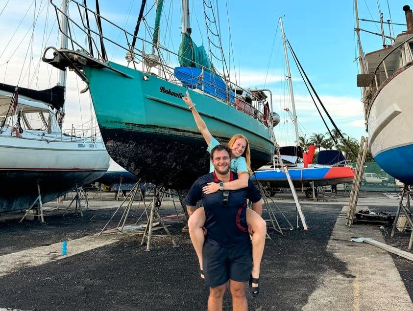 A couple spent £62,000 to live full-time on a sailboat, despite no sailing experience. Their adventure has brought them closer, as they learn to navigate life at sea.