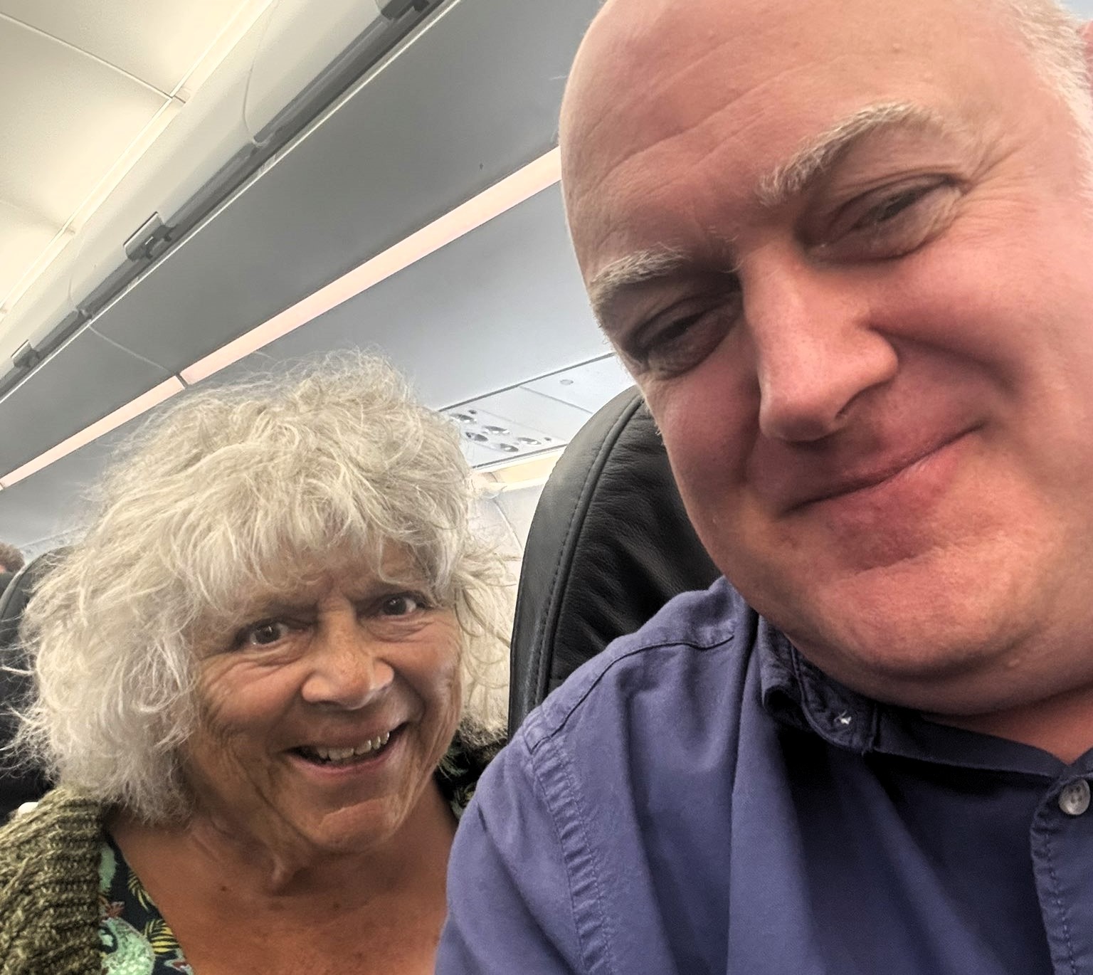 Comedian Dara Ó Briain shares a flight with "national treasure" Miriam Margolyes after Edinburgh Fringe, sparking fan banter about her mischievous charm. A memorable encounter!