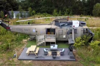 Stay in a former Royal Navy helicopter at RAF Wainfleet in Lincolnshire. Experience unique military-themed accommodations with stunning lakeside views starting at £130/night.