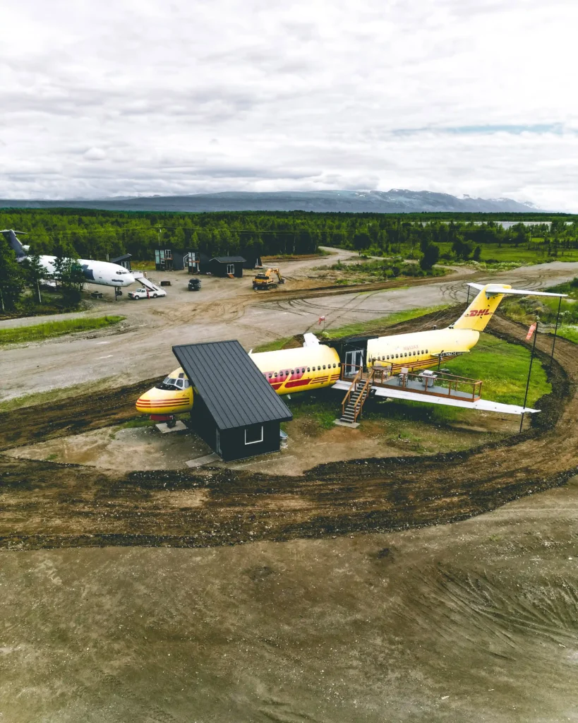 Experience a unique stay in a converted DHL jet turned Airbnb, complete with a wing deck and sauna, nestled in the breathtaking Alaskan wilderness. Book now for an unforgettable adventure!